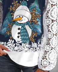Blus med spets- och snögubbemönster