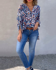 Blus med V-ringning och blommig tryck och långa ärmar